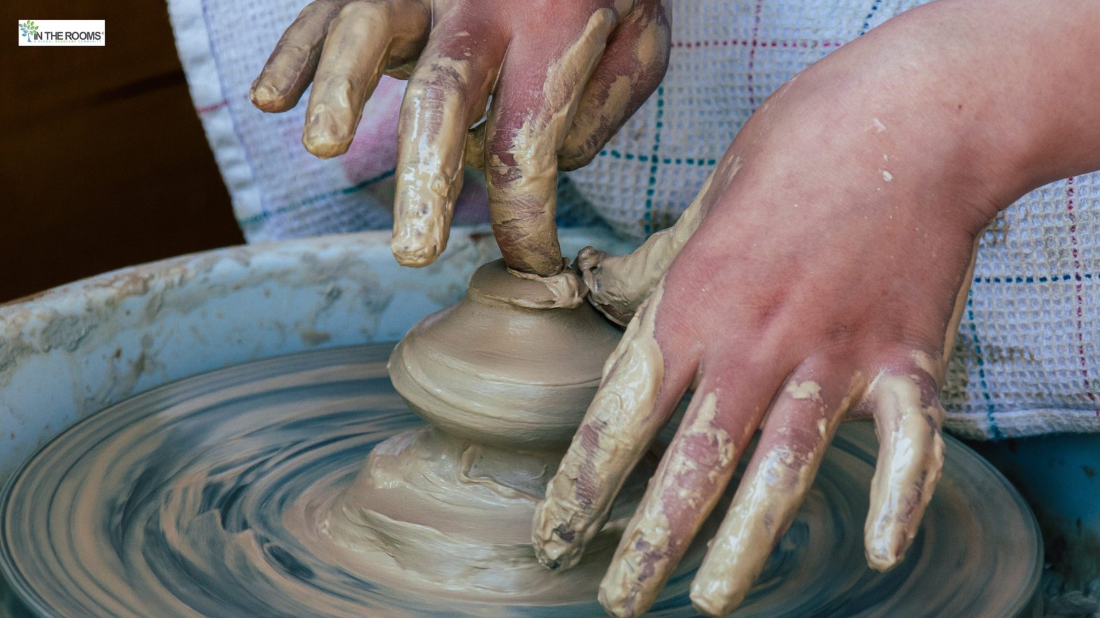 Hands shaping clay on a pottery wheel, representing creative hobbies that support recovery.