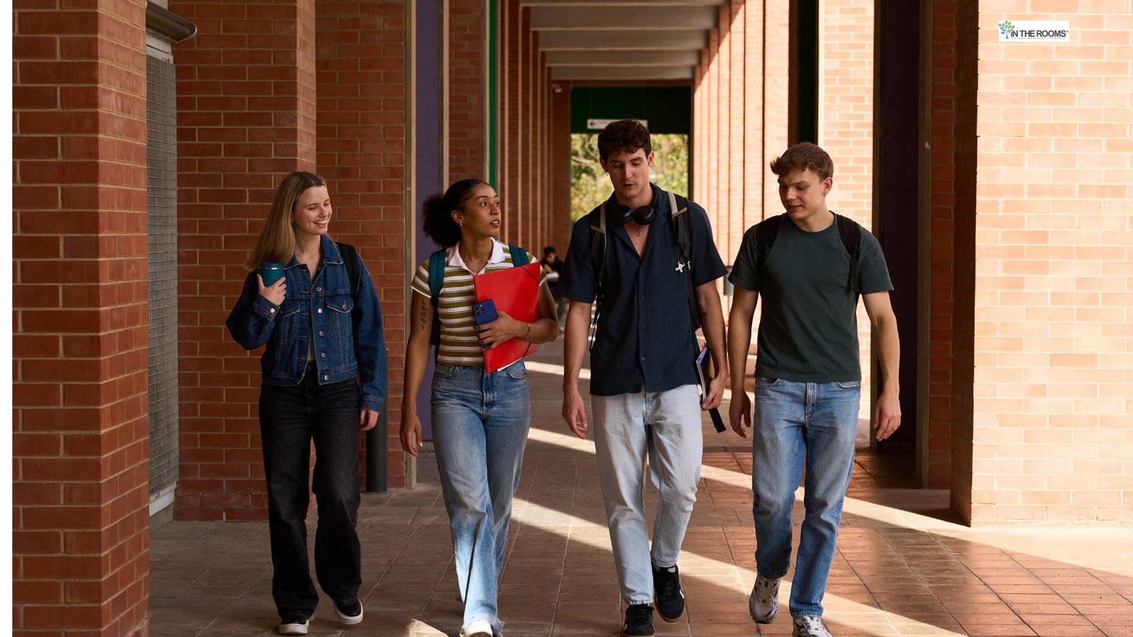 Group of college students walking together on campus, representing living fully and sober in college.